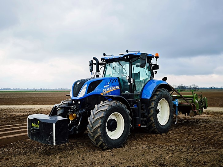 CHCNAV auto-steering display inside a tractor cabin.